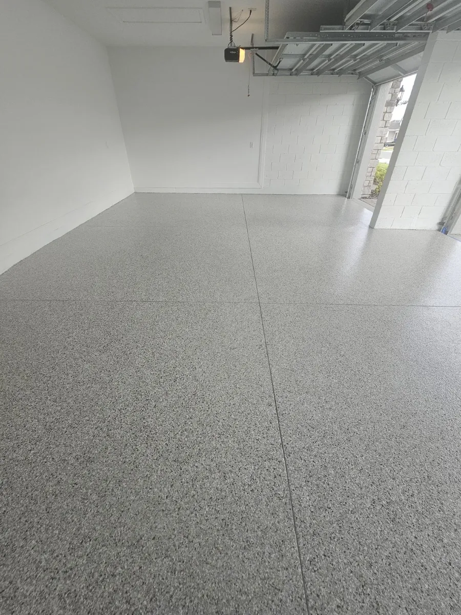 Empty two-car garage floor coating by Elite Epoxy Surfaces