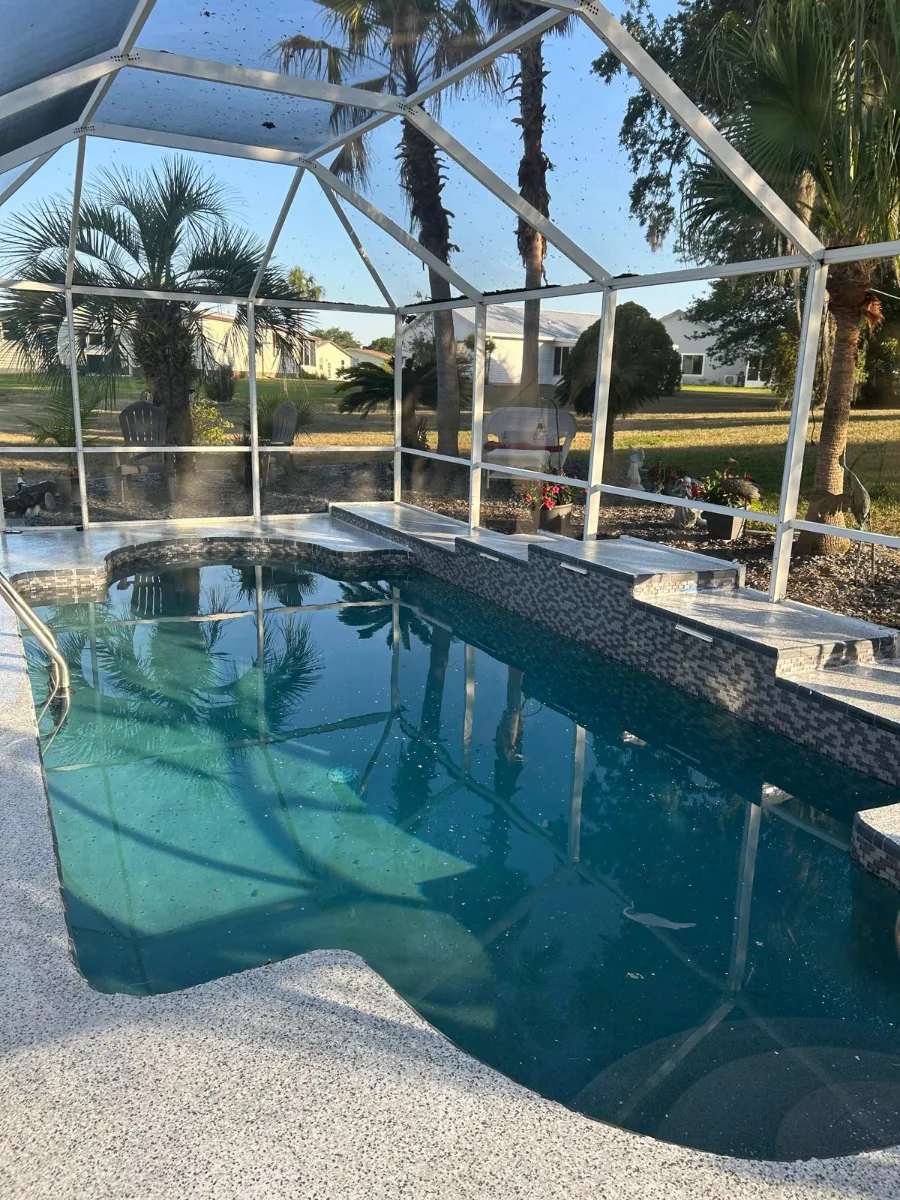 Slip-resistant cool-touch coating on a residential pool deck