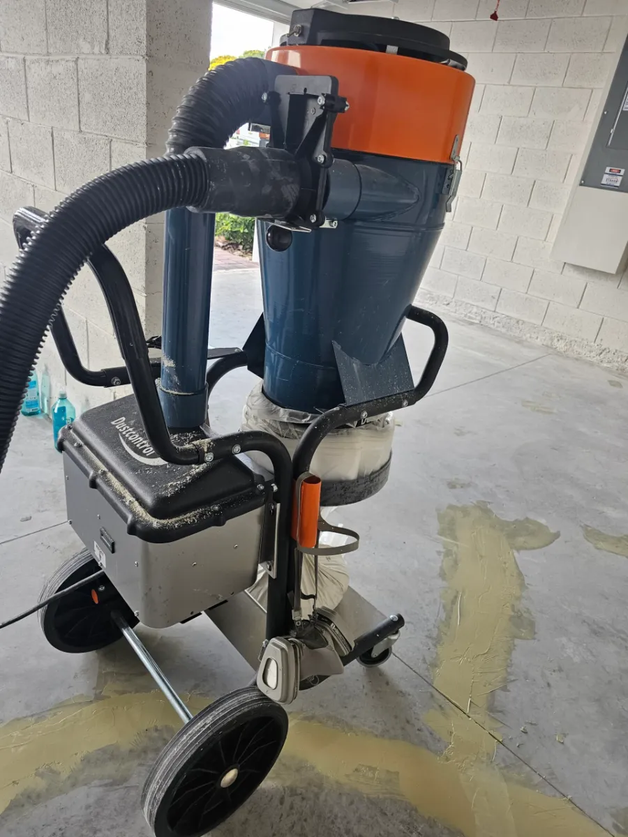 Professional dust-control equipment used during floor prep